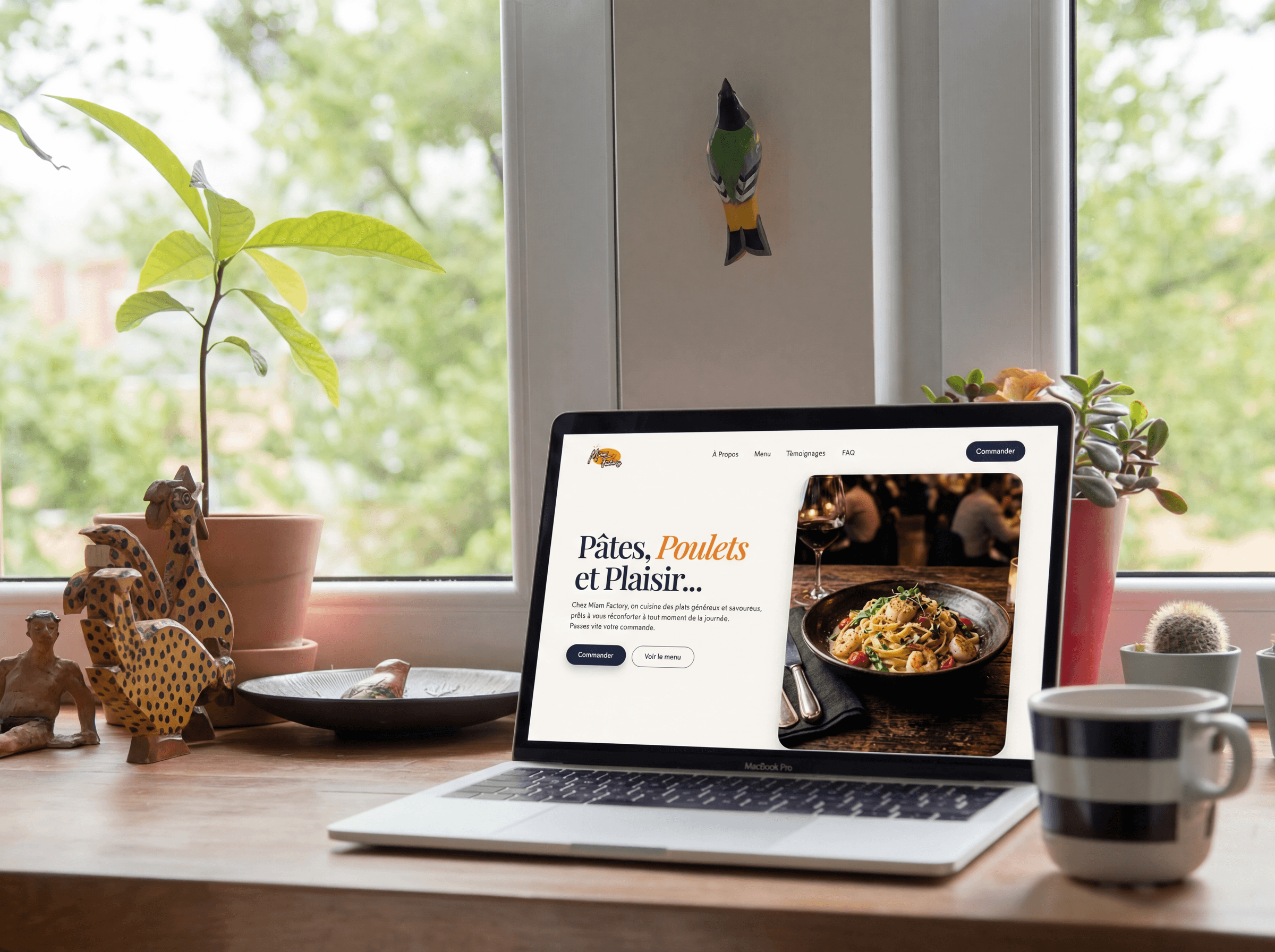 Miam Factory laptop mockup on restaurant desk